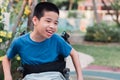 Disabled kid in garden with family in the outdoor Royalty Free Stock Photo