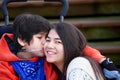 Disabled little boy kissing his big sister on cheek Royalty Free Stock Photo