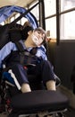 Disabled little boy in wheelchair on school bus Royalty Free Stock Photo