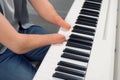 Disabled man with amputated two stump hands musician is playing piano. Royalty Free Stock Photo
