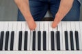 Disabled man with amputated two stump hands musician is playing piano. Royalty Free Stock Photo