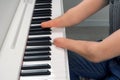 Disabled man with amputated two stump hands musician is playing piano. Royalty Free Stock Photo