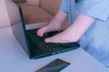 Disabled man with amputated two stump hands works typing on laptop closeup view. Royalty Free Stock Photo