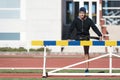 Disabled man athlete stretching with leg prosthesis. Paralympic