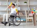 Disabled man cleaning floor at home