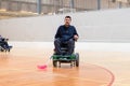 Disabled man on an electric wheelchair playing sports, powerchair hockey. IWAS - International wheelchair and amputee Royalty Free Stock Photo