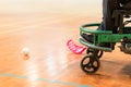 Disabled man on an electric wheelchair playing sports, powerchair hockey. IWAS - International wheelchair and amputee Royalty Free Stock Photo