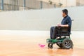 Disabled man on an electric wheelchair playing sports, powerchair hockey. IWAS - International wheelchair and amputee