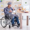 Disabled man preparing soup at kitchen Royalty Free Stock Photo