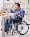 Disabled man preparing soup at kitchen Royalty Free Stock Photo