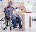 Disabled man preparing soup at kitchen Royalty Free Stock Photo