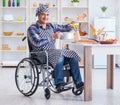 Disabled man preparing soup at kitchen Royalty Free Stock Photo