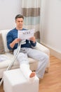 Disabled man reading newspaper Royalty Free Stock Photo