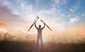 A disabled man standing up and raising his crutches Royalty Free Stock Photo