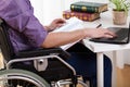 Disabled man studying at home
