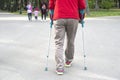 Disabled man using crutches to walk on a fresh air. Royalty Free Stock Photo