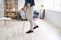 Disabled Man Using Crutches To Walk Royalty Free Stock Photo