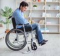 Disabled man on wheelchair cleaning home