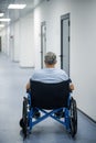 Disabled man in a wheelchair in a rehabilitation center Royalty Free Stock Photo