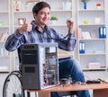 Disabled man on wheelchair repairing computer Royalty Free Stock Photo