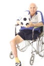 Disabled man in wheelchair with soccer ball
