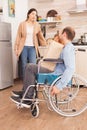 Disabled man in wheelchair with fresh groceries