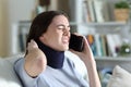 Disabled painful woman with neck brace talking on phone