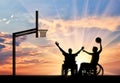 Disabled paralympians in wheelchair play basketball