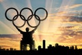 Disabled paralympic keep olympic rings sunset city