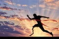 Disabled paralympic runner with prosthetic crossing finish line sunset Royalty Free Stock Photo