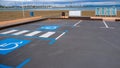 Disabled parking divided by a pedestrian crossing on the beach background