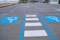 Disabled parking divided by a pedestrian crossing on the empty beach