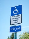 Disabled Parking Permit Sign $250 Fine on Blue Sky in the State of Florida Royalty Free Stock Photo