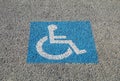 Disabled parking permit sign painted on the street