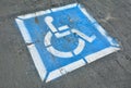 Disabled parking sign painted on asphalt. Royalty Free Stock Photo