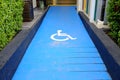 Disabled parking sign on slope pathway