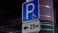 Disabled parking sign. Underground parking. Cars parked in a shopping center. Royalty Free Stock Photo