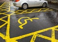 Disabled Parking Space Sign Painted On The Tarmac In a UK Car Park carpark [at a train station Royalty Free Stock Photo