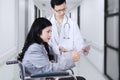 Disabled patient and doctor looking at tablet Royalty Free Stock Photo