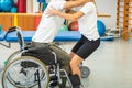 Proper lifting technique from a wheelchair Royalty Free Stock Photo