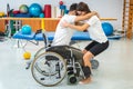 Proper lifting technique from a wheelchair Royalty Free Stock Photo