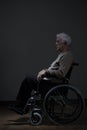 Disabled pensioner using wheelchair Royalty Free Stock Photo