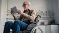 disabled pensioner in wheelchair using digital Royalty Free Stock Photo