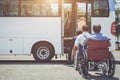 Disabled people sitting on wheelchair and going to the public bu