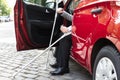 Disabled Person Getting In A Car Royalty Free Stock Photo