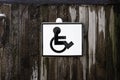 Disabled person sign on a wooden frozen wall Royalty Free Stock Photo