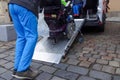 Disabled person on wheelchair using car lift Royalty Free Stock Photo