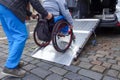 Disabled person on wheelchair using car lift Royalty Free Stock Photo