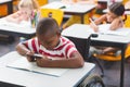 Disabled schoolboy using digital tablet