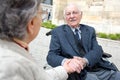 Disabled senior man holding wifes hand Royalty Free Stock Photo